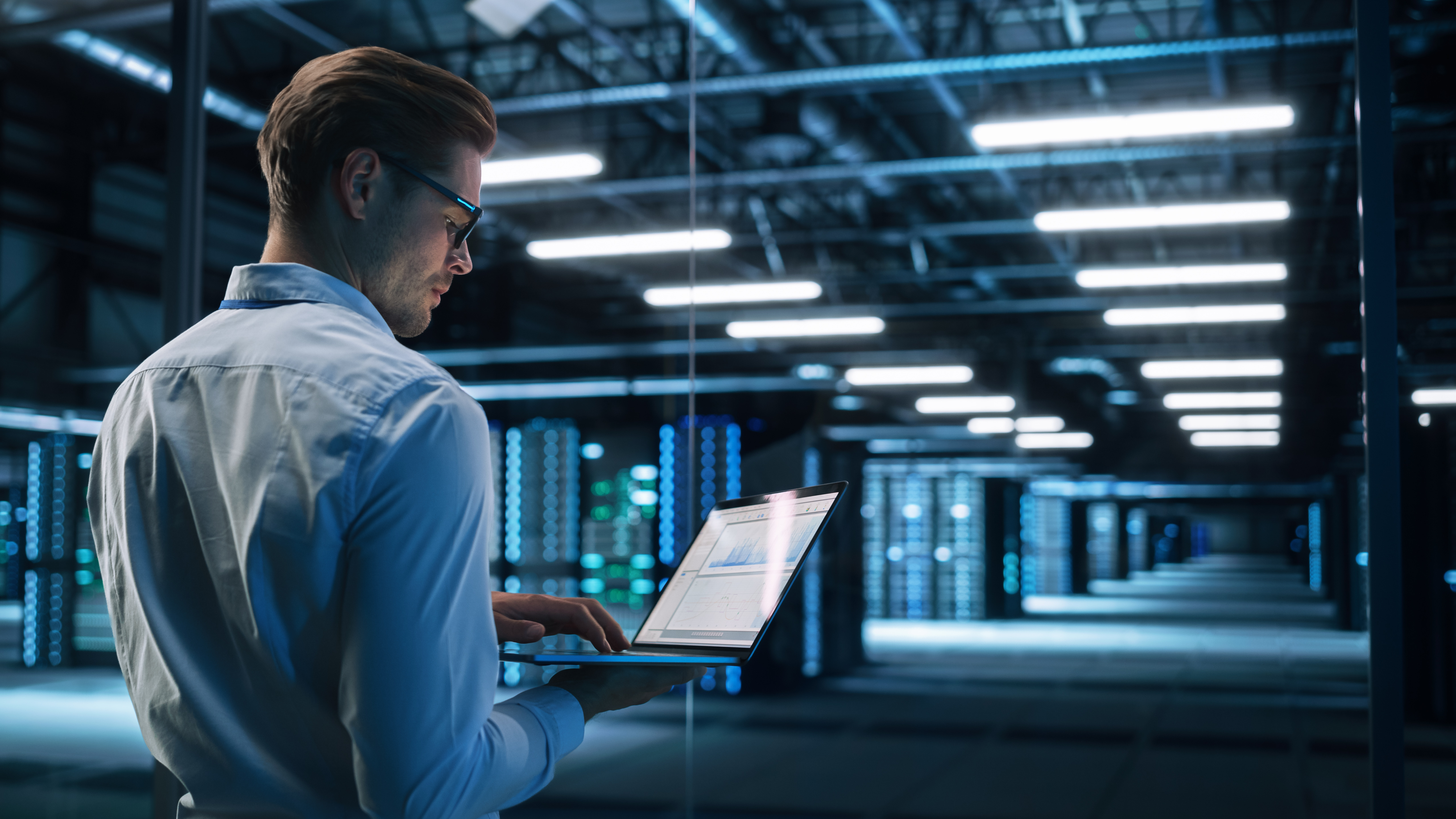 Security operations analyst monitoring AI-driven SOC playbooks across real-time dashboards in a control room