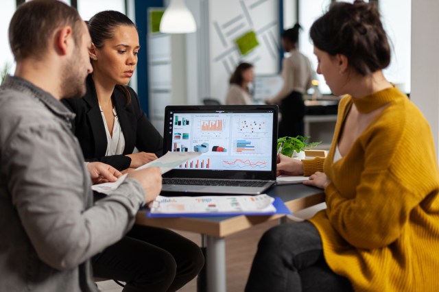 Business leaders reviewing data and dashboards to validate Q1 go-to-market strategy
