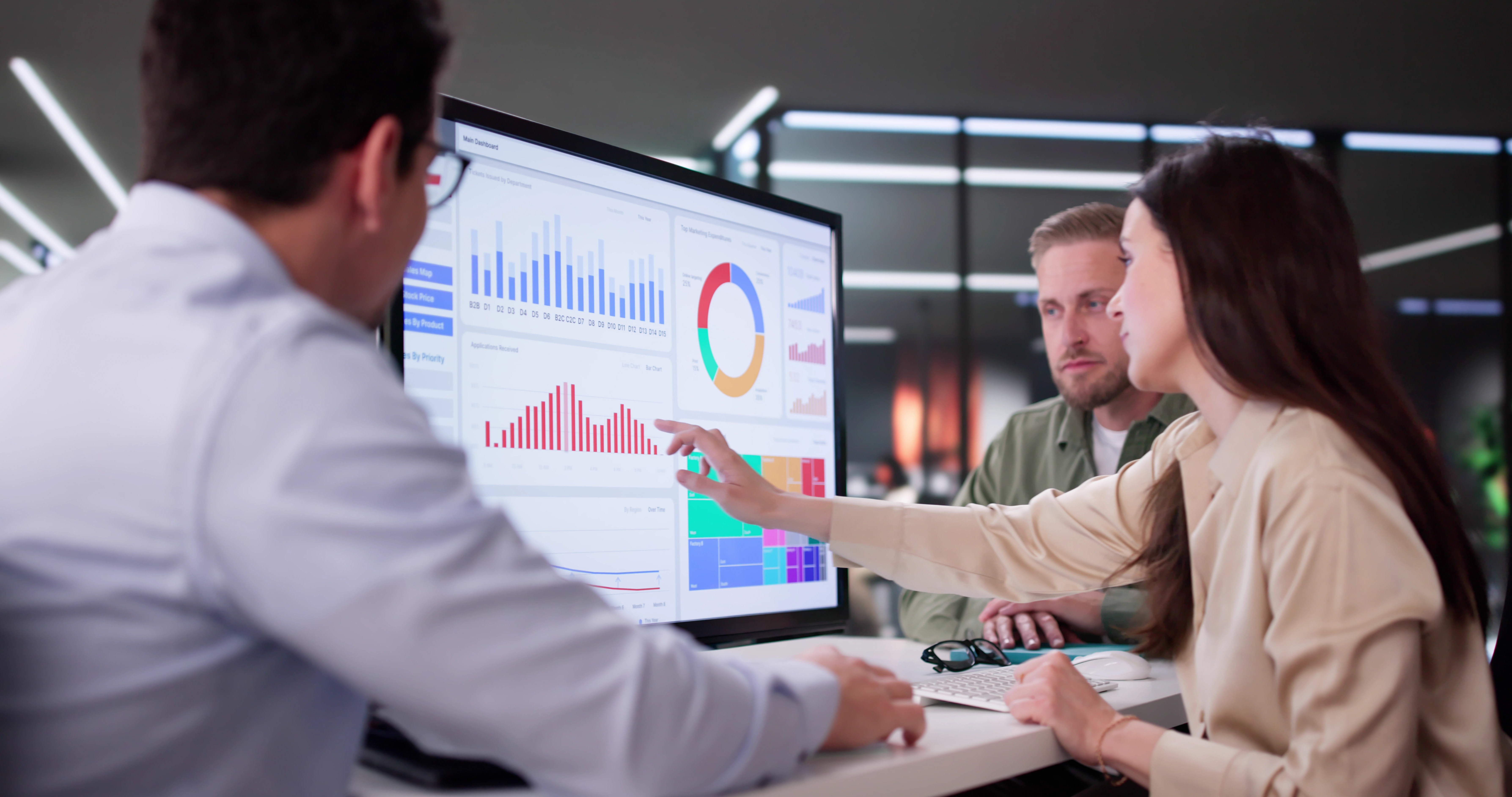 Team reviewing analytics dashboard to evaluate AI data pricing and governance